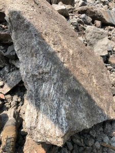 Spodumene in dyke hosted by pegmatite