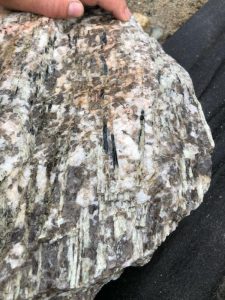 Spodumene in dyke hosted by pegmatite