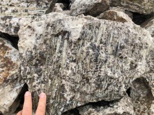 Spodumene in dyke hosted by pegmatite